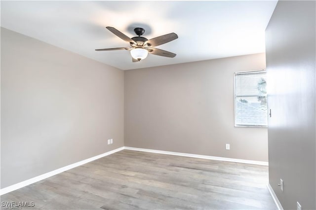1431 Monarch Cir Unit B8, Naples, FL 34116 - unfurnished room featuring ceiling fan, baseboards, and wood finished floors