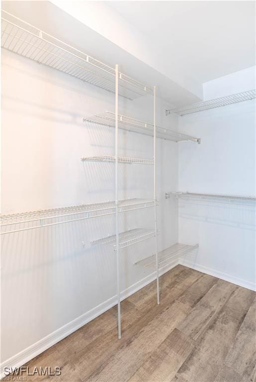 1431 Monarch Cir Unit B8, Naples, FL 34116 - spacious closet with wood finished floors