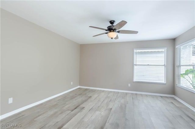 1431 Monarch Cir Unit B8, Naples, FL 34116 - unfurnished room featuring ceiling fan, light wood finished floors, and baseboards