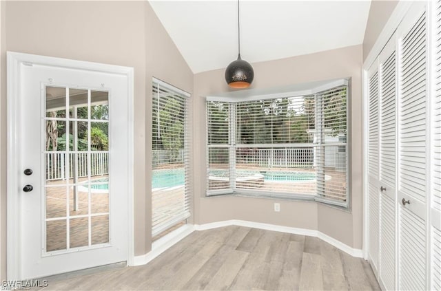 1431 Monarch Cir Unit B8, Naples, FL 34116 - unfurnished sunroom with vaulted ceiling