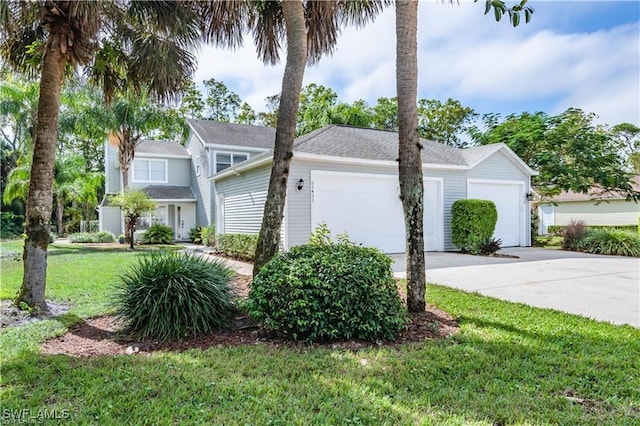 1431 Monarch Cir Unit B8, Naples, FL 34116 - view of front of home featuring an attached garage, driveway, and a front lawn