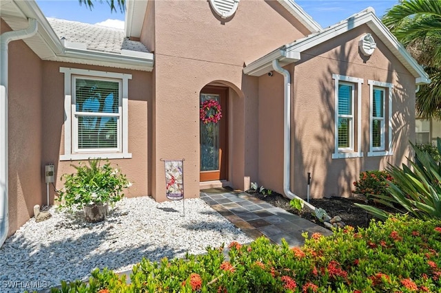 16232 Quesa Dr, Punta Gorda, FL 33955 - doorway to property with stucco siding