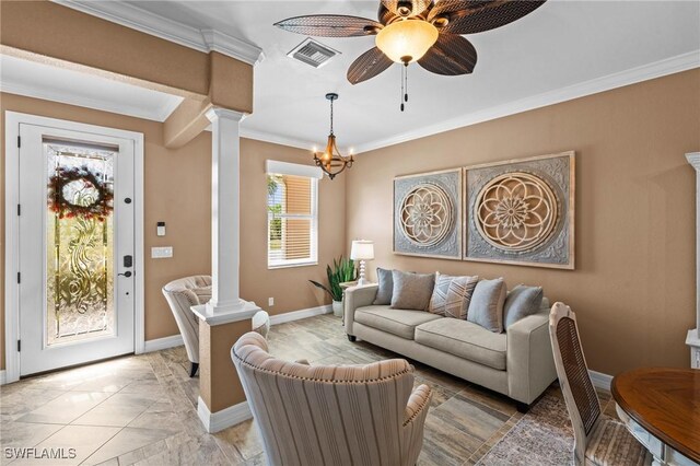 16232 Quesa Dr, Punta Gorda, FL 33955 - living area featuring decorative columns, ornamental molding, baseboards, a ceiling fan, and a chandelier