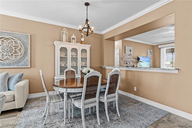 16232 Quesa Dr, Punta Gorda, FL 33955 - dining space featuring a chandelier, ornamental molding, and baseboards