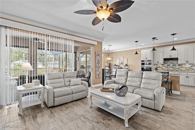 16232 Quesa Dr, Punta Gorda, FL 33955 - living room featuring ornamental molding, ceiling fan, and baseboards