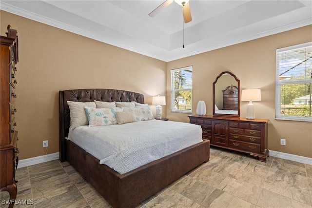 16232 Quesa Dr, Punta Gorda, FL 33955 - bedroom with multiple windows, a raised ceiling, baseboards, ornamental molding, and a ceiling fan