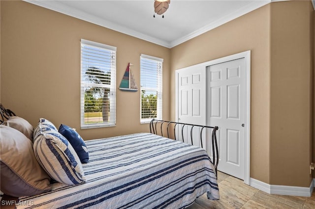 16232 Quesa Dr, Punta Gorda, FL 33955 - bedroom featuring ornamental molding, baseboards, a closet, and ceiling fan