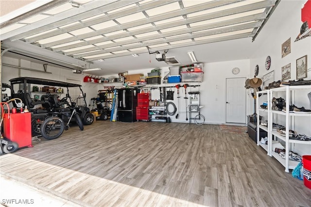16232 Quesa Dr, Punta Gorda, FL 33955 - garage featuring a garage door opener