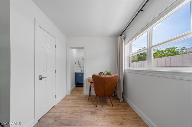 1300 Hilltop Dr, Naples, FL 34103 - corridor with light wood-type flooring and baseboards