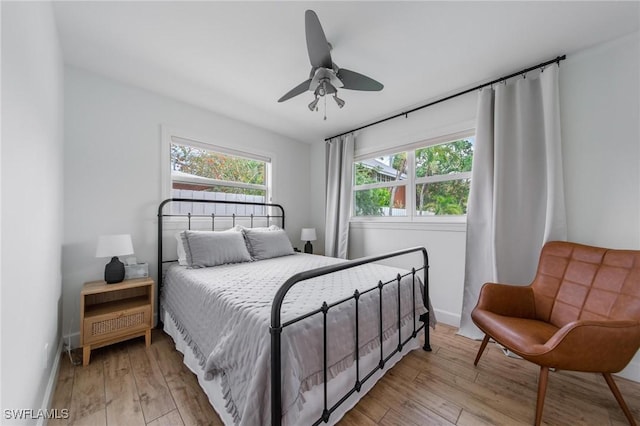 1300 Hilltop Dr, Naples, FL 34103 - bedroom featuring light wood-style flooring, baseboards, and ceiling fan