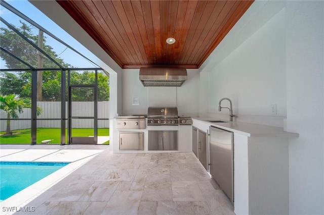 1300 Hilltop Dr, Naples, FL 34103 - view of patio with a sink, exterior kitchen, fence, grilling area, and glass enclosure