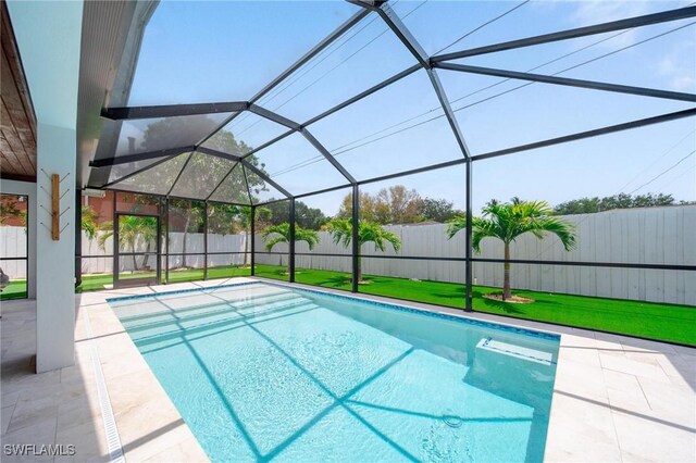 1300 Hilltop Dr, Naples, FL 34103 - view of swimming pool featuring a patio and glass enclosure