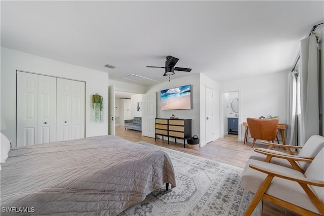 1300 Hilltop Dr, Naples, FL 34103 - bedroom featuring wood finished floors, a ceiling fan, and a closet