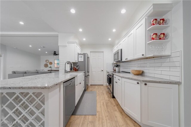 1300 Hilltop Dr, Naples, FL 34103 - kitchen with appliances with stainless steel finishes, white cabinetry, a peninsula, recessed lighting, and a sink