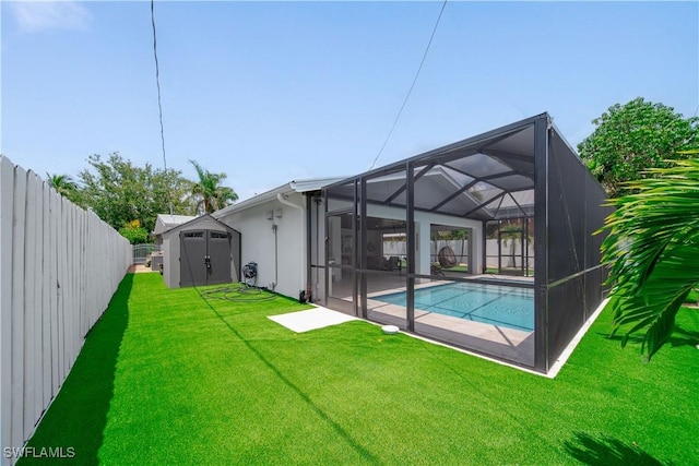 1300 Hilltop Dr, Naples, FL 34103 - back of property with a storage unit, an outdoor structure, a patio area, stucco siding, and a lanai