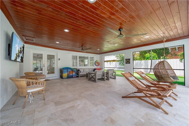 1300 Hilltop Dr, Naples, FL 34103 - sunroom with french doors, a ceiling fan, and an outdoor hangout area