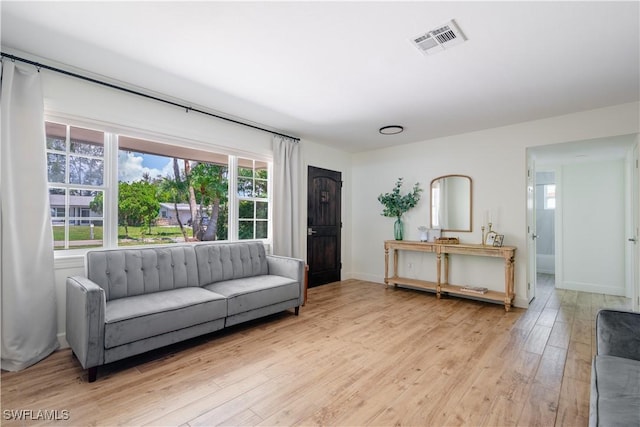 1300 Hilltop Dr, Naples, FL 34103 - living room featuring light wood-style floors and baseboards