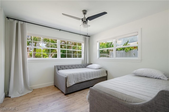 1300 Hilltop Dr, Naples, FL 34103 - bedroom featuring light wood-style flooring, baseboards, and a ceiling fan