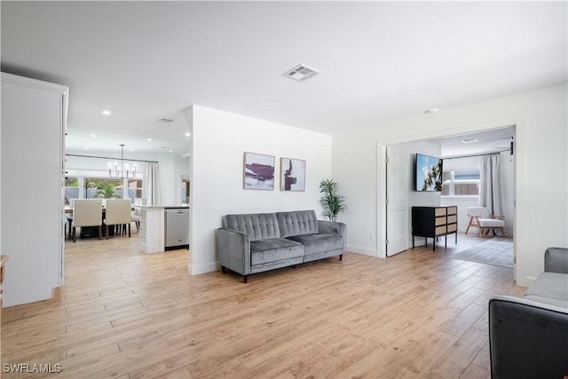 1300 Hilltop Dr, Naples, FL 34103 - living area featuring light wood finished floors, a chandelier, and recessed lighting
