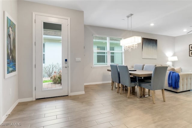 1256 Enbrook Loop, Naples, FL 34114 - dining space with a chandelier, baseboards, light wood finished floors, and recessed lighting