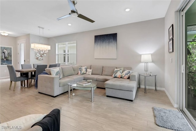 1256 Enbrook Loop, Naples, FL 34114 - living room featuring baseboards, a ceiling fan, a chandelier, light wood-style flooring, and recessed lighting
