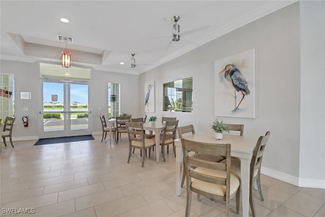1256 Enbrook Loop, Naples, FL 34114 - dining space with plenty of natural light, ornamental molding, a ceiling fan, baseboards, and a raised ceiling