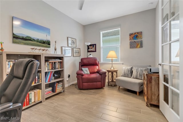 1256 Enbrook Loop, Naples, FL 34114 - sitting room with wood finished floors and baseboards