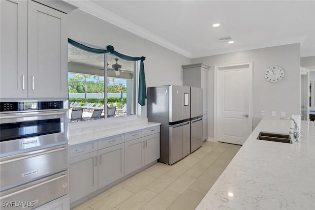 1256 Enbrook Loop, Naples, FL 34114 - kitchen featuring a sink, stainless steel appliances, gray cabinetry, a warming drawer, and ornamental molding