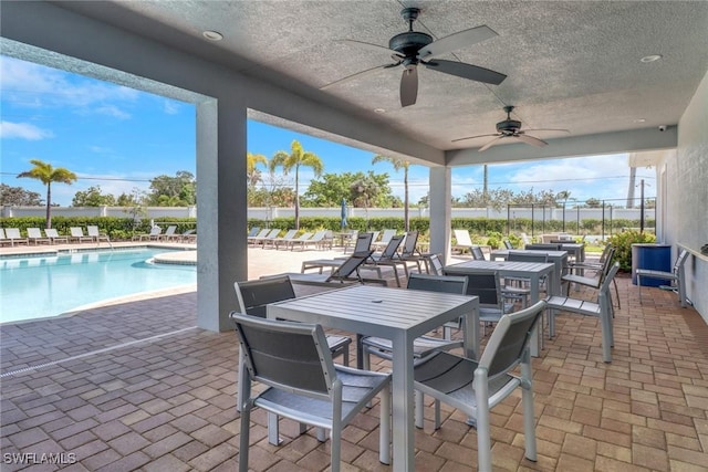 1256 Enbrook Loop, Naples, FL 34114 - view of patio featuring a ceiling fan and a community pool