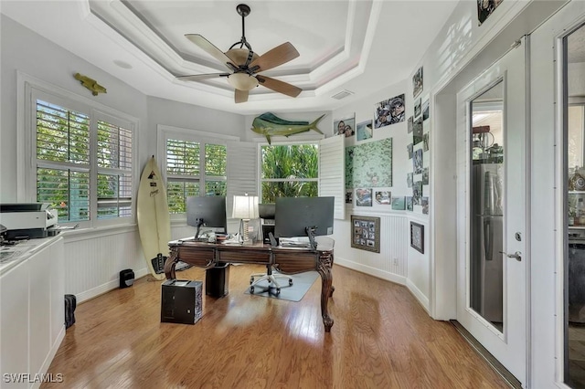 1817 Piccadilly Cir, Cape Coral, FL 33991 - office area with wood finished floors, a ceiling fan, and a raised ceiling