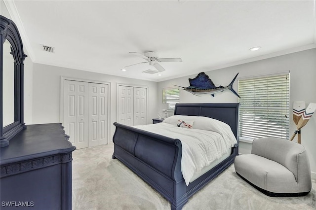 1817 Piccadilly Cir, Cape Coral, FL 33991 - bedroom with two closets, light colored carpet, recessed lighting, a ceiling fan, and ornamental molding