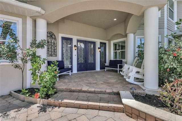 1817 Piccadilly Cir, Cape Coral, FL 33991 - property entrance with french doors and stucco siding