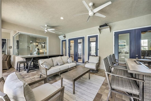 1817 Piccadilly Cir, Cape Coral, FL 33991 - wooden deck with french doors, an outdoor hangout area, a ceiling fan, and a patio
