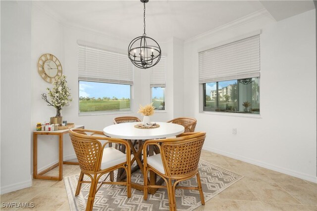 43030 Greenway Blvd Unit 417, Punta Gorda, FL 33982 - dining space featuring ornamental molding, a chandelier, and baseboards