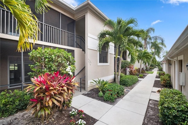 10260 Heritage Bay Blvd Unit 3515, Naples, FL 34120 - view of side of home featuring stucco siding