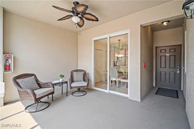 10260 Heritage Bay Blvd Unit 3515, Naples, FL 34120 - sitting room with a textured wall and ceiling fan