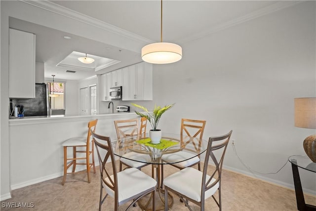 10260 Heritage Bay Blvd Unit 3515, Naples, FL 34120 - dining room featuring a raised ceiling, baseboards, and crown molding