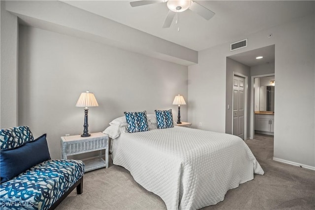 10260 Heritage Bay Blvd Unit 3515, Naples, FL 34120 - carpeted bedroom featuring baseboards, ensuite bathroom, and ceiling fan