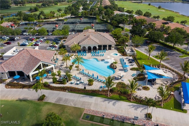 10260 Heritage Bay Blvd Unit 3515, Naples, FL 34120 - drone / aerial view of a pool area, a golf course, and a large body of water
