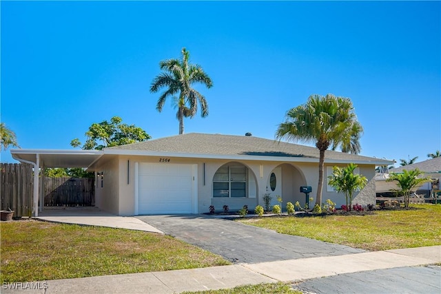 2564 Poinciana St, Naples, FL 34105 - single story home featuring stucco siding, driveway, an attached carport, and a garage