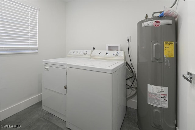 2564 Poinciana St, Naples, FL 34105 - washroom featuring water heater, washing machine and dryer, and baseboards