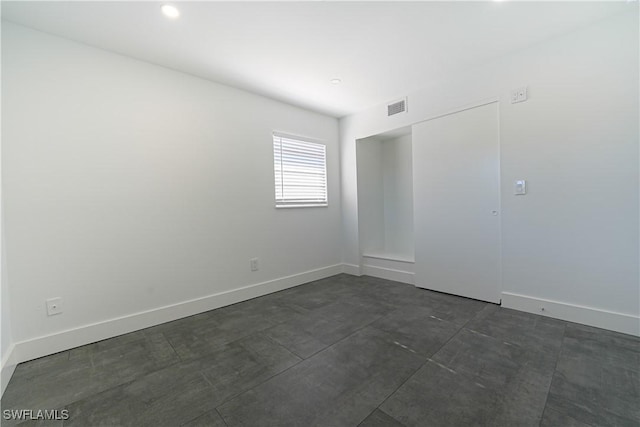 2564 Poinciana St, Naples, FL 34105 - spare room featuring baseboards and recessed lighting