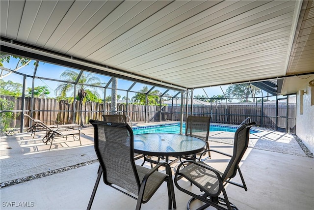 2564 Poinciana St, Naples, FL 34105 - fenced backyard with a patio area and glass enclosure