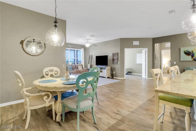 11711 Pasetto Ln Unit 407, Fort Myers, FL 33908 - dining area featuring light wood finished floors, baseboards, and ceiling fan