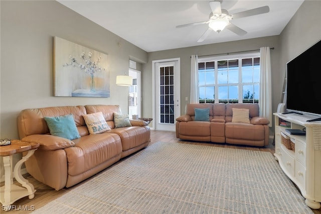 11711 Pasetto Ln Unit 407, Fort Myers, FL 33908 - living room with ceiling fan and wood finished floors