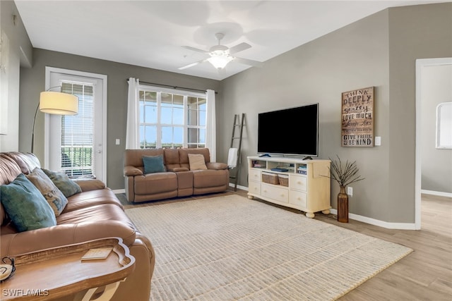 11711 Pasetto Ln Unit 407, Fort Myers, FL 33908 - living area with baseboards, a ceiling fan, and light wood finished floors