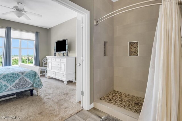 11711 Pasetto Ln Unit 407, Fort Myers, FL 33908 - ensuite bathroom with a tile shower, a ceiling fan, and vanity