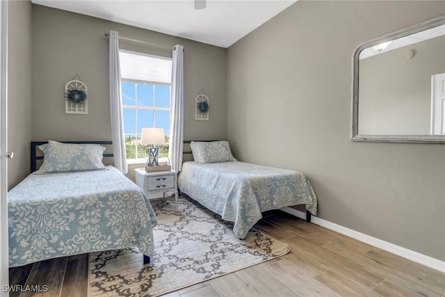 11711 Pasetto Ln Unit 407, Fort Myers, FL 33908 - bedroom featuring wood finished floors, baseboards, and ceiling fan