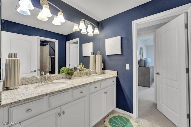 2369 Tangerine Ln, Naples, FL 34120 - full bath featuring a textured wall, double vanity, a chandelier, tiled shower, and tile patterned floors