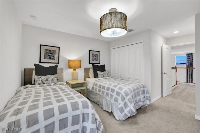 2369 Tangerine Ln, Naples, FL 34120 - bedroom with a closet, light colored carpet, and baseboards